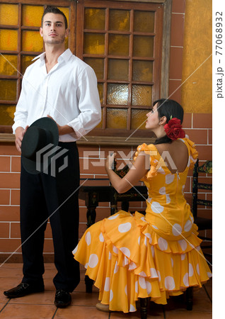 Flamenco dancers from Seville in Spain prepared to dance in a typical Spanish venue 77068932