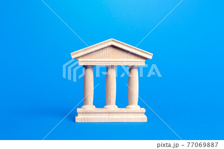 Building figurine with pillars in antique style. Concept of city administration, bank, university, court or library. Banking, education, government. Architectural monument in the old part of the city. Building figurine with pillars in antique style. Concept of city administration, bank, university, court or library. Banking, education, government. Architectural monument in the old part of the city. 77069887