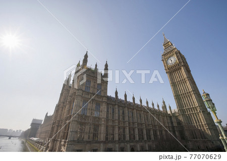 Low angle view of Big Ben and parliament building against clear sky at London; England; UK Low angle view of Big Ben and parliament building against clear sky at London; England; UK 77070629