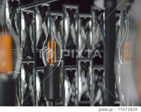 3d illustration of modern chandelier hanging on ceiling closeup 77073820