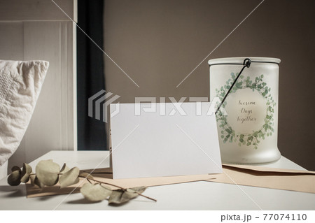 blank greeting card  invitation mockup with craft paper envelope  feminine still life composition 77074110