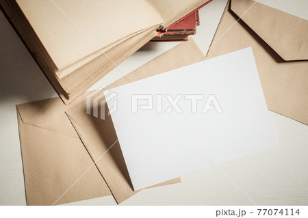 blank greeting card  invitation mockup with craft paper envelope  feminine still life composition 77074114