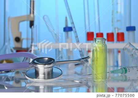 Medical Lab Desk with Chemical Glassware and Stethoscope 77075500