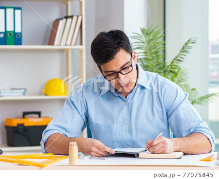 Construction engineer working on new project Construction engineer working on new project 77075845