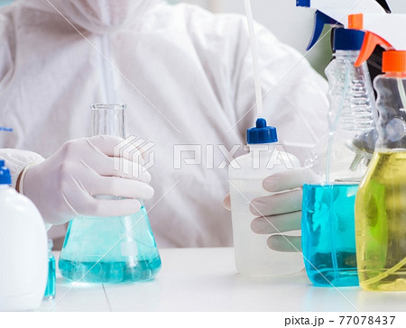 Chemist checking the quality of bathroom supplies 77078437