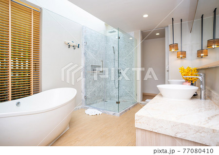 white bathtub in luxury bathroom white bathtub in luxury bathroom 77080410