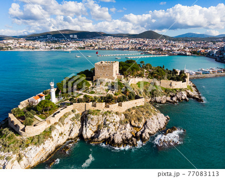Pigeon Island with Kusadasi harbor. Aegean coast of Turkey. Pigeon Island with Kusadasi harbor. Aegean coast of Turkey. 77083113