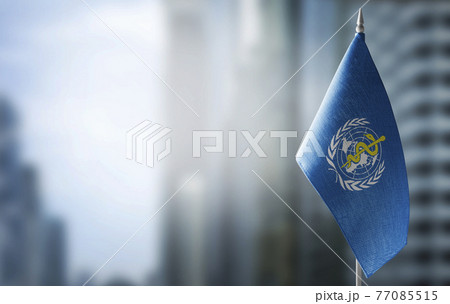 Patch of the national flag of the World Health Organization WHO on a white t-shirt 77085515