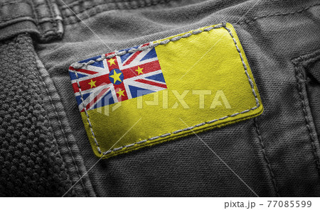 Tag on dark clothing in the form of the flag of the Niue 77085599