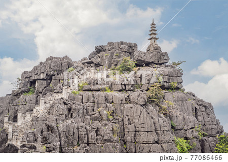 Top pagoda of Hang Mua temple, rice fields, Ninh Binh, Vietnam. Vietnam reopens borders after quarantine Coronovirus COVID 19 77086466