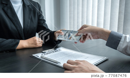Dishonest cheating in business illegal money, Business woman giving bribe money in business people to give success the deal contract of investment, Bribery and corruption concept Dishonest cheating in business illegal money, Business woman giving bribe money in business people to give success the deal contract of investment, Bribery and corruption concept 77087476