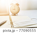 Work from home, stay at home, learning online education to avoid corona virus or COVID-19 concept : Anti virus protection mask on open notebook paper, digital tablet and clock on working desk table 77090555