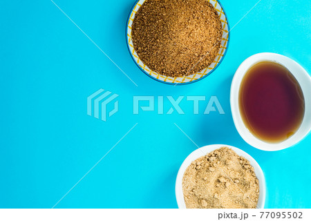 Different Kinds of Sugar and Sweeteners in the Bowls 77095502