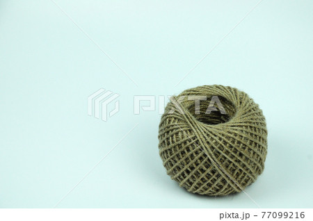 Isolated image of Hemp rope ball sting on white background. Isolated image of Hemp rope ball sting on white background. 77099216
