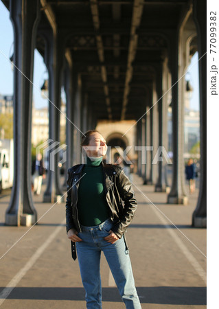 Young blonde girl walking in european city, Milan. Young blonde girl walking in european city, Milan. 77099382
