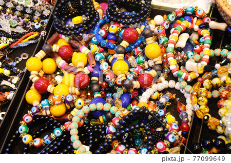 KUCHING, MALAYSIA -DECEMBER 07, 2016: Traditional Malaysian Sarawak ethnic woman accessories. Bracelets and necklaces made from made of special stones and animal skins. 77099649