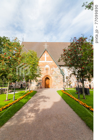 Hollola, Finland - 9 September 2019: Old medieval stone church of St. Mary in Hollola, Finland 77099890