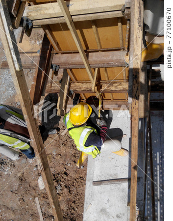 MALACCA, MALAYSIA -SEPTEMBER 19, 2016: Column timber form work and reinforcement bar at the construction site in Malacca, Malaysia. The structure supported by temporary wood support 77100670