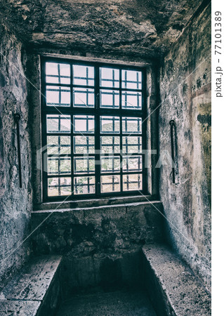 External view of an ancient vintage window of a medieval town in Italy, Europe. 77101389