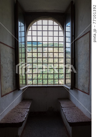 External view of an ancient vintage window of a medieval town in Italy, Europe. External view of an ancient vintage window of a medieval town in Italy, Europe. 77101392