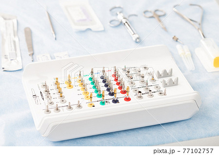 set of instruments for dental implantation on the dentist's table 77102757