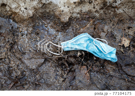 Picture of throwed used medical mask on the ground Picture of throwed used medical mask on the ground 77104175