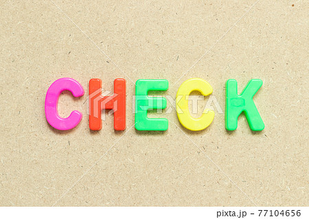 Color alphabet letter with word check on wood background 77104656