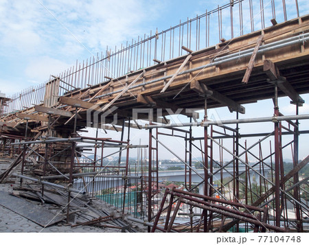 SELANGOR, MALAYSIA -FEBRUARY 20, 2017: Pile of used timber form work at the construction site. It will be demobilize from construction site to recycle or to dispose. SELANGOR, MALAYSIA -FEBRUARY 20, 2017: Pile of used timber form work at the construction site. It will be demobilize from construction site to recycle or to dispose. 77104748