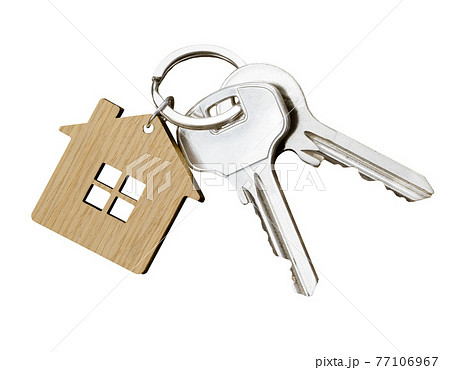 House keys with house shaped keychain isolated on white background 77106967