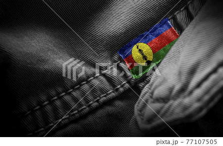 Tag on dark clothing in the form of the flag of the New Caledonia 77107505