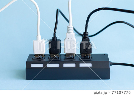 USB hub with multiple usb ports for cables close-up 77107776
