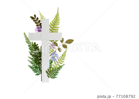 The Christianity cross of green leaves. Baptism, Easter, church holiday background 77108792