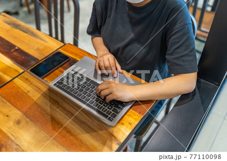 High angle view of female working or studying on laptop High angle view of female working or studying on laptop 77110098