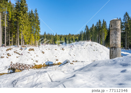 Broken dam in winter mountains Broken dam in winter mountains 77112346
