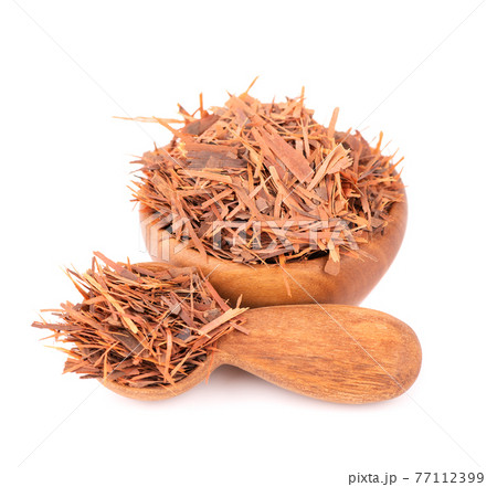 Lapacho herbal tea in wooden bowl, isolated on white background. Natural Taheeboo dry tea. Pau d'arco herb. Tabebuia heptophylla. Lapacho herbal tea in wooden bowl, isolated on white background. Natural Taheeboo dry tea. Pau d'arco herb. Tabebuia heptophylla. 77112399