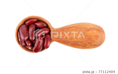Red kidney beans in wooden spoon, isolated on white background. Rajma or Mexican Bean. Beans close up. Top view. Red kidney beans in wooden spoon, isolated on white background. Rajma or Mexican Bean. Beans close up. Top view. 77112404