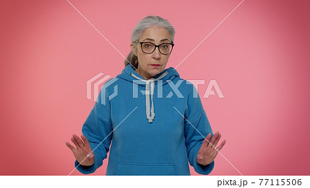 Displeased unpleasant upset senior grandmother wave hand, shake head dismiss idea dont like proposal Displeased unpleasant upset senior grandmother wave hand, shake head dismiss idea dont like proposal 77115506