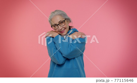 Mature old granny grandmother spread hands and give hug to you, pleasant expression, love feelings Mature old granny grandmother spread hands and give hug to you, pleasant expression, love feelings 77115646