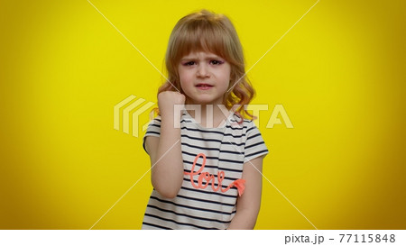 Funny aggressive blonde kid child trying to fight, shaking fist, boxing with expression, punishment Funny aggressive blonde kid child trying to fight, shaking fist, boxing with expression, punishment 77115848