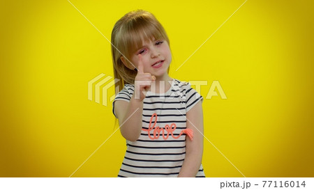 Kid child shakes finger and saying no, be careful, scolding, giving advice to avoid danger mistake 77116014