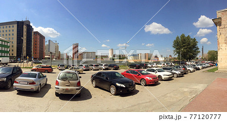 Outdoor cars parking during sunny day under the blue sky. Outdoor cars parking during sunny day under the blue sky. 77120777