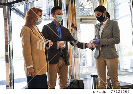 Sanitary rules require temperature measuring for the visitors 77125562