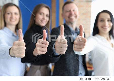 Group of business people showing thumbs up closeup 77126181