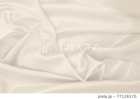 Smooth elegant golden silk or satin luxury cloth texture as wedding background. Luxurious background design. In Sepia toned. Retro style 77126570