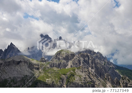 Peak between the clouds Peak between the clouds 77127349