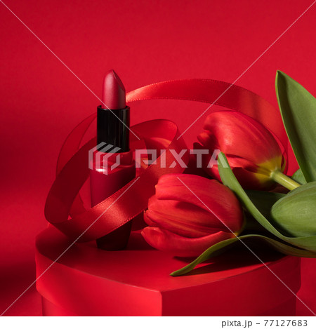 Gift box for women, mothers day, lipstick and red tulips Gift box for women, mothers day, lipstick and red tulips 77127683