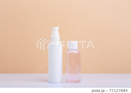 Face moisturizing cream and exfoliating skin lotion against beige background with copy space Face moisturizing cream and exfoliating skin lotion against beige background with copy space 77127684