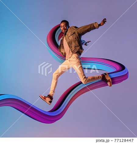 Stylish man with long fluid flood on gradient background. Negative space to insert your text. Modern design. Contemporary colorful and conceptual bright art collage. 77128447