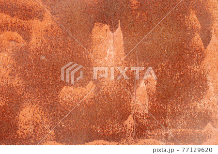 Textured grunge background red peeling paint with rust on old metal surface 77129620
