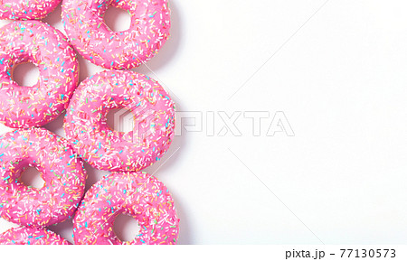 Left pink yummy donuts border. Top view.  77130573